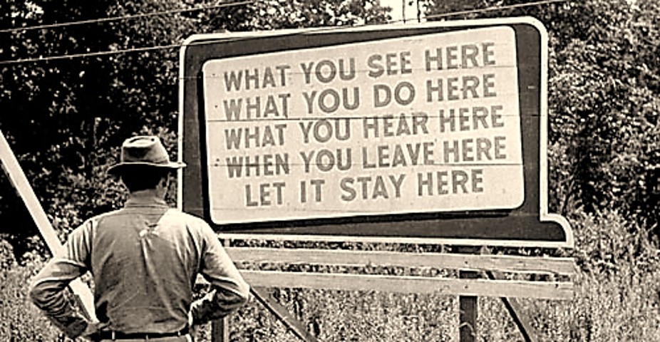 Man at Sign What you see here etc Oak Ridge TN 1940s